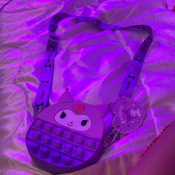 This is a mini purse it is a pop it purse it is multicolored. - Picture 1 of 3